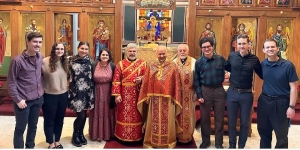 Orthodox Volunteer Corps members with Father Costa, Father Hisham, and Decon Kary standing in front of the iconostasis