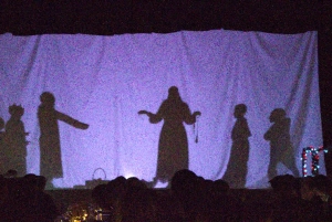 Saint Basil Academy youth and children putting on a shadow-box Christmas play