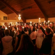 An Orthodox Christian congregation raising their candles at Pascha in an Orthodox Church