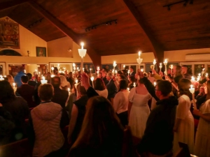 An Orthodox Christian congregation raising their candles at Pascha in an Orthodox Church