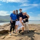 A group of youth from Saint Basil Academy on a rock with the Hudson River behind them