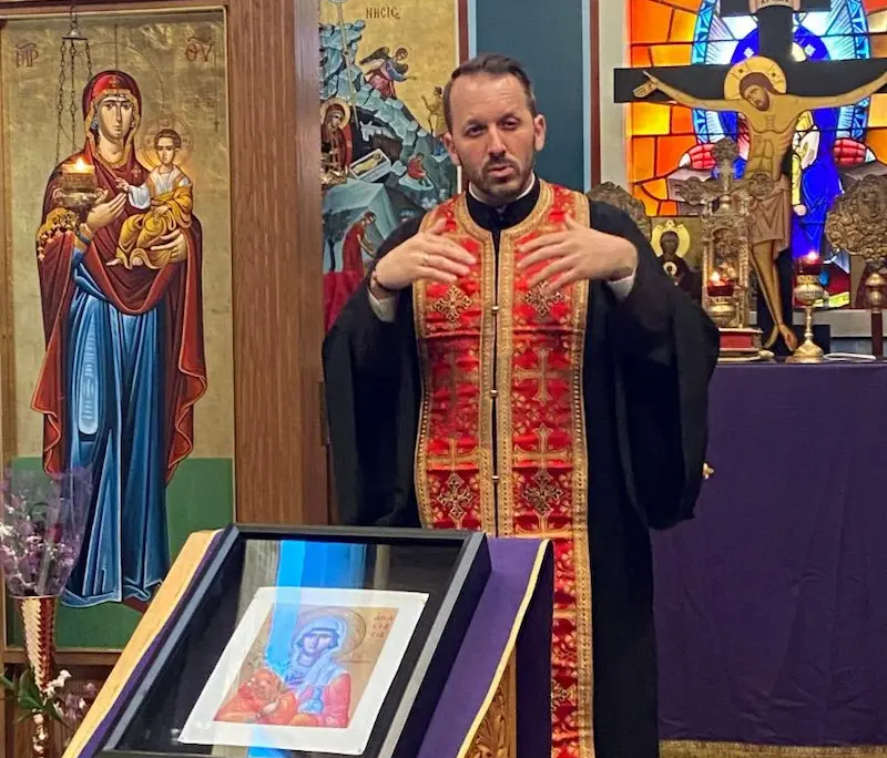 Father Nikolas Delaveris speaking during a paraklesis service at Saint Basil Chapel
