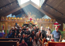 A group posing in front of the iconostasis at Saint Basil chapel for Good Friday