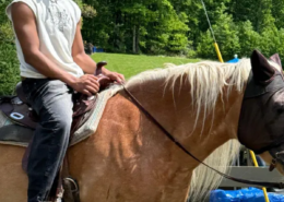 707012630_1274808291479396_6102730462860882153_n A youth from Saint Basil Academy riding a horse while visiting the Rocking Horse Ranch