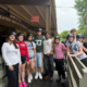 Saint Basil Academy youth at on a trip to Rocking Horse Ranch standing outside the stables.