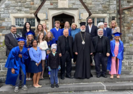 2026 graduation A group of Saint Basil Academy graduates and staff in front of the main building.