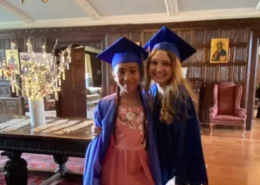 Saint Basil Academy graduates Two graduates of Saint Basil Academy wearing cap and gown smiling