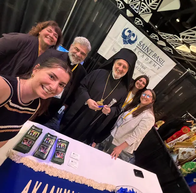 CL1 Staff and clergy with Archbishop Elpidophoros at the Saint Basil table at Clergy-Laity Congress