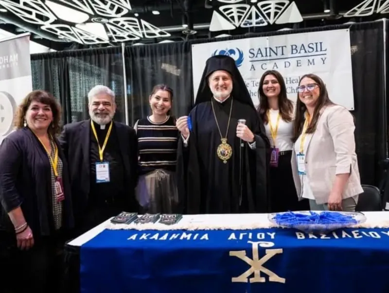 The Saint Basil Academy table at Clergy Laity Conference 2026 Saint Basil staff at Clergy Laity Conference with Archbishop Elpidophoros