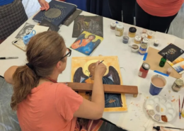 Icon painting retreat at Saint Basil Academy A woman painting an icon of Archangel Michael at an icon painting retreat at Saint Basil Academy.