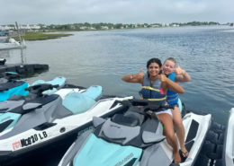 Ocean City youth field trip Two female youth sitting on a jet ski wearing life jackets during a Saint Basil summer field trip to Ocean City.