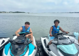 Ocean City youth field trip Two male youth each sitting on a jet ski wearing blue life jackets during a Saint Basil summer field trip to Ocean City.