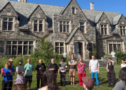 Staff in-service training Saint Basil Academy staff outside in a circle holding string interconnected string during an in-service training