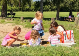 Summer playtime Five young girls playing in the sand on the Saint Basil Academy campus.