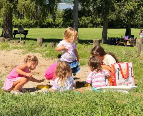 Five young girls playing in the sand on the Saint Basil Academy campus.
