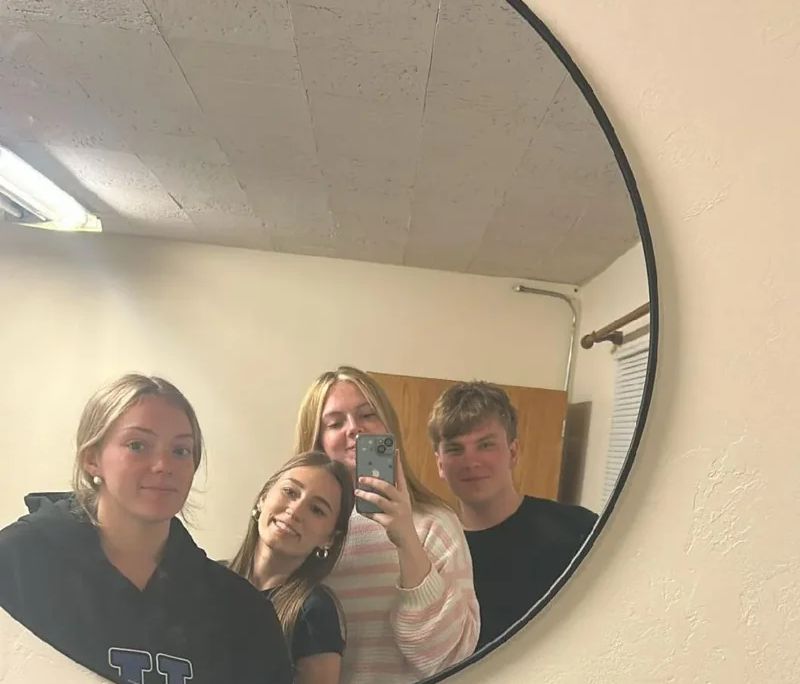 Saint Basil youth Four Saint Basil Academy high schoolers posing in a mirror for a selfie