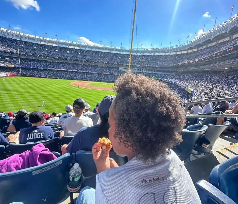 Yankees baseball game A view of Yankee Stadium from over the shoulder of a child