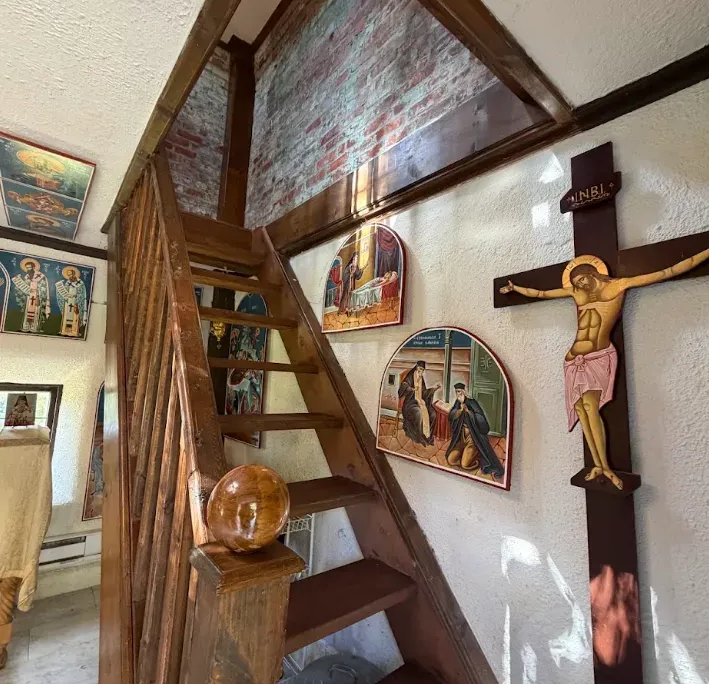 Saint Dionysios of Zakynthos Chapel Inside Saint Dionysios of Zakynthos Chapel looking up the wooden stairs with icons on the walls